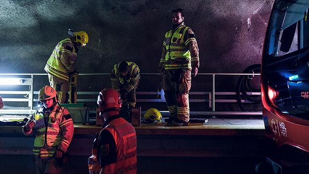 Firefighters in metro tunnel.